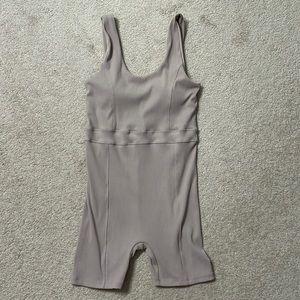 Ribbed one piece shorts bodysuit.  Mauvey beige color. Size XL
